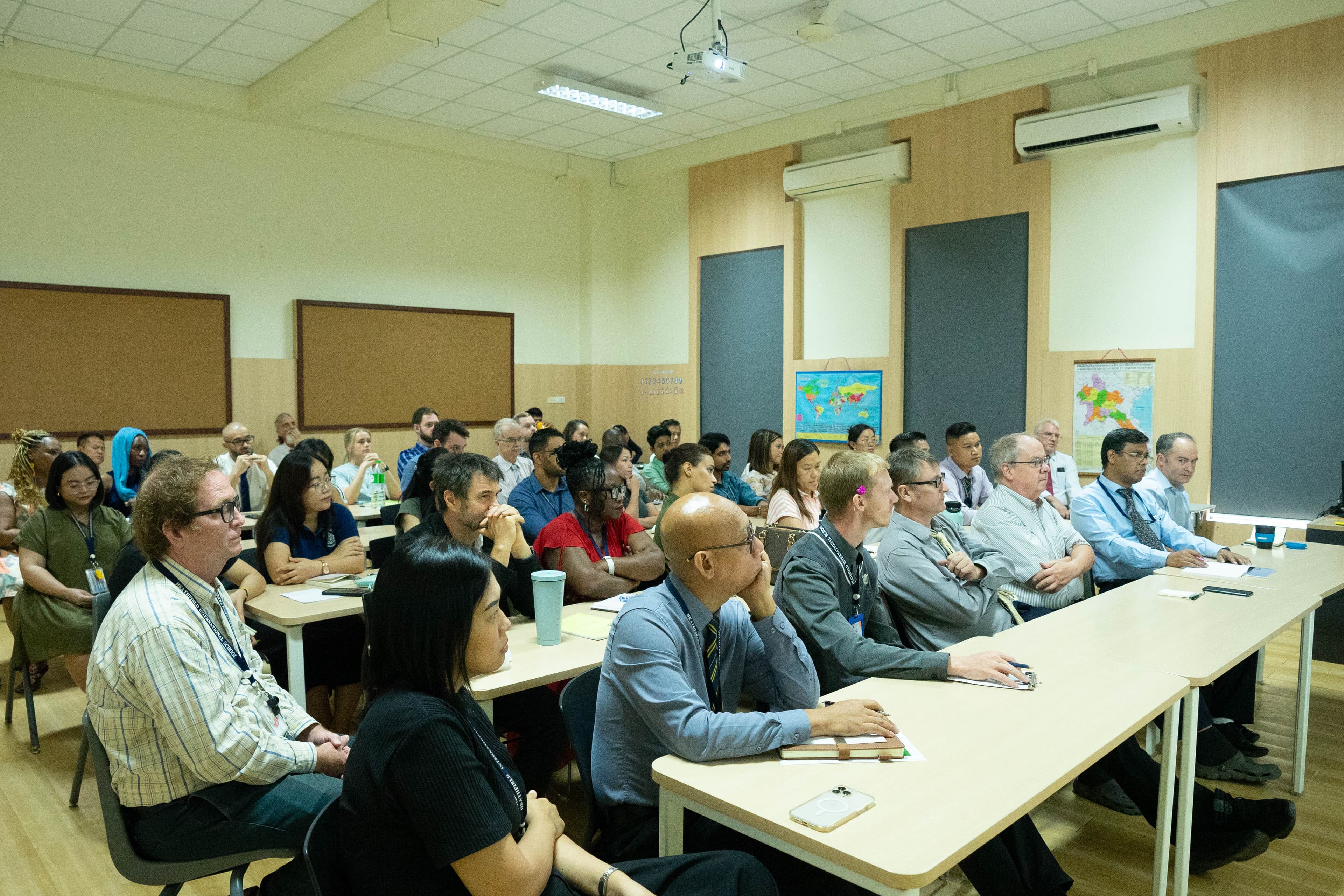 Students and teacher around a globe